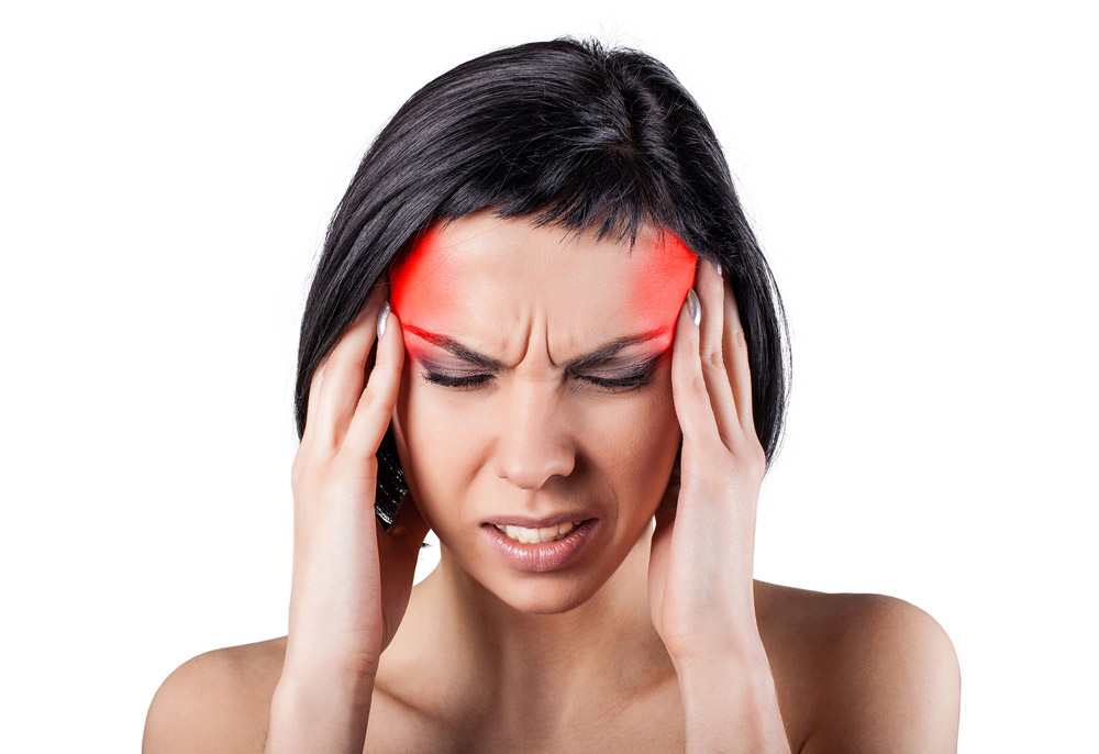 woman enduring headaches and migraines