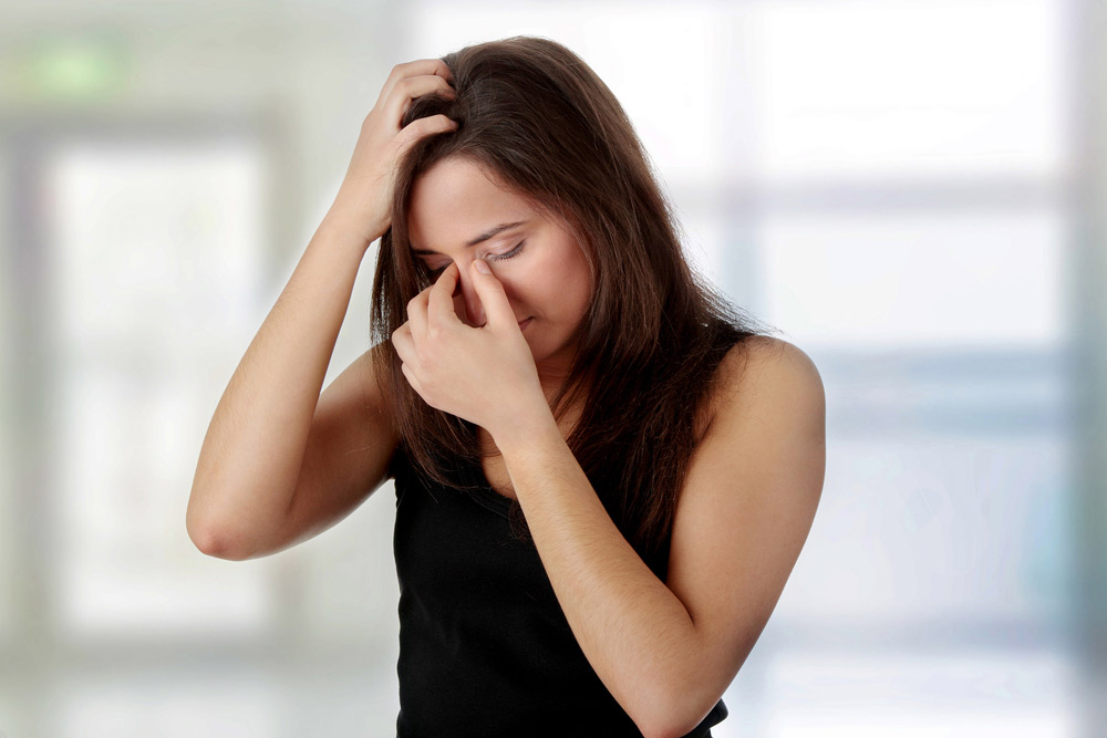 woman experiencing headaches